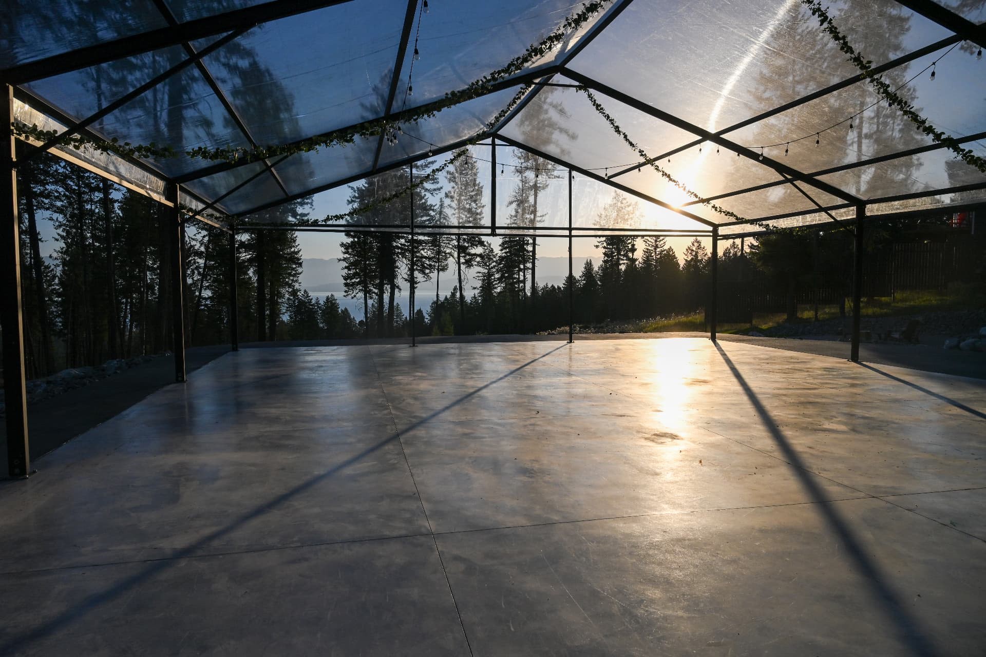 The reception pavilion at dusk with Flathead Lake beyond